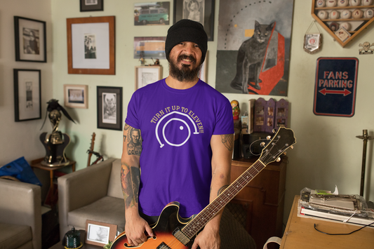 A rock tshirt with the text "turn it up to eleven" and the graphics of a volume knob.