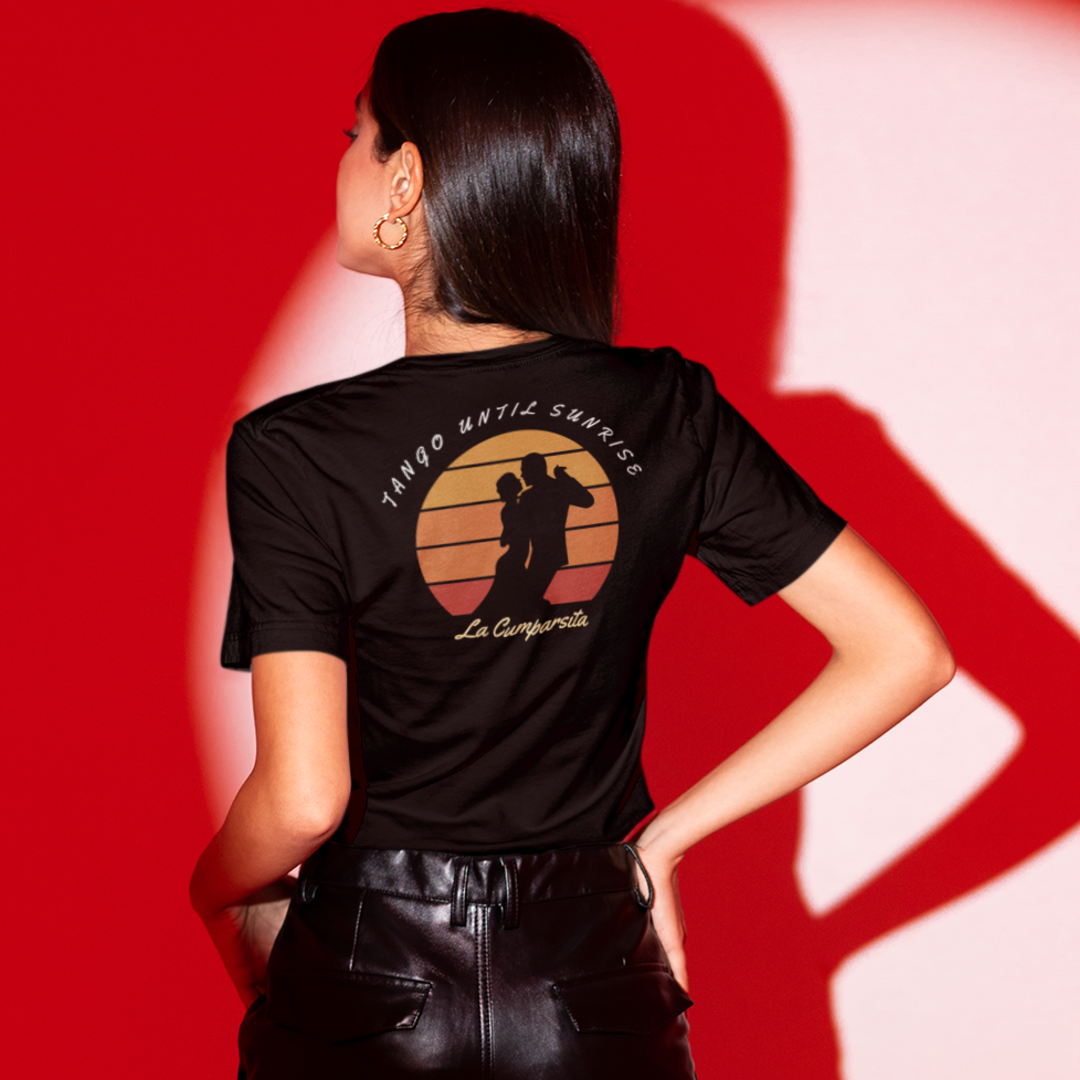A dance tshirt design for argentine tango dancers. It has the text "tango until sunrise. La Cumparsita" and the graphics of a couple dancing while the sun is setting