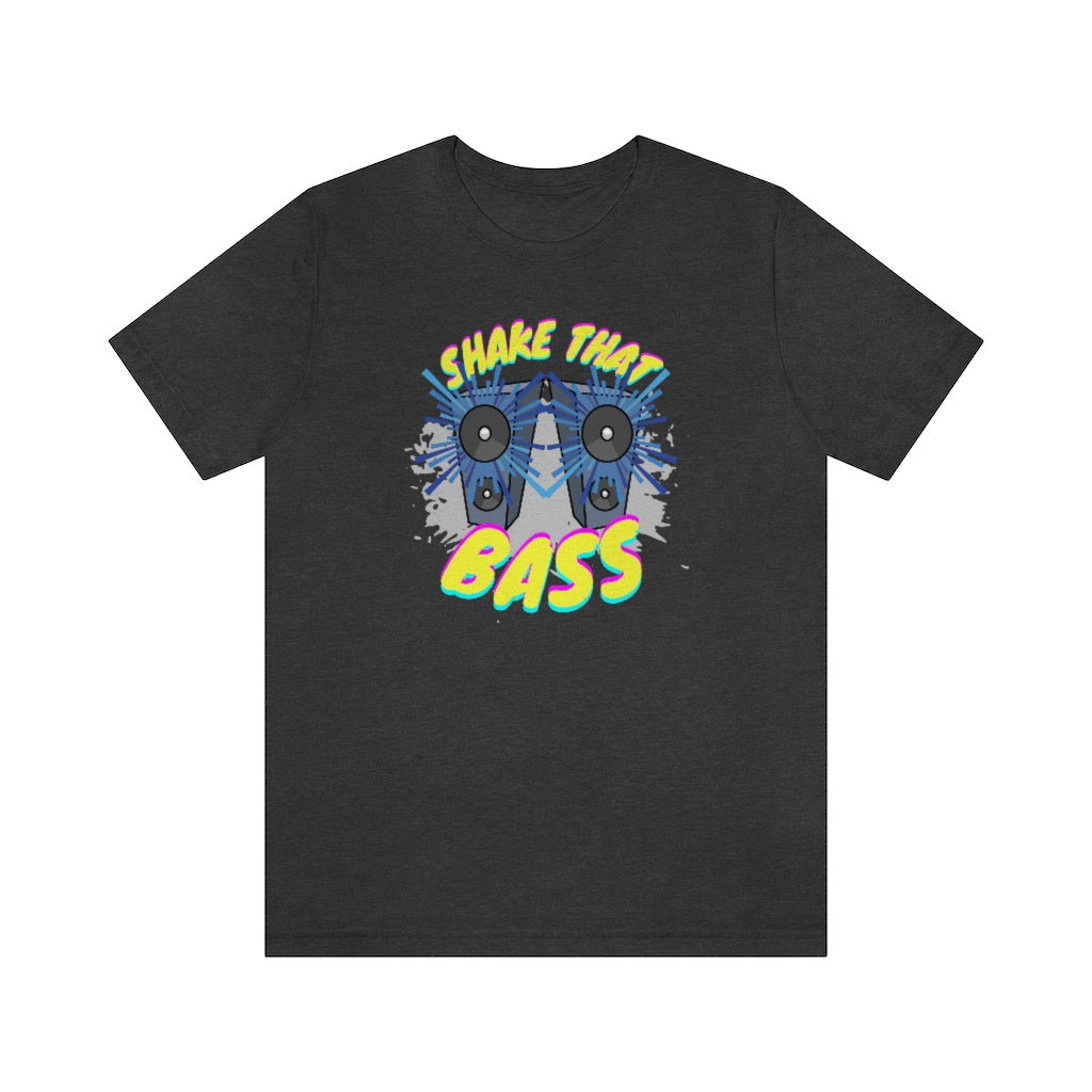 A dark grey T-shirt with two large speakers on it which seem to play loud music. It has the text "Shake That Bass".