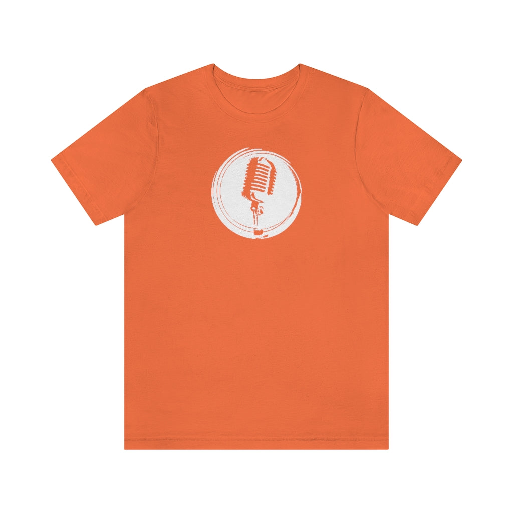 An orange T-shirt with a vintage microphone on a retro stylized circle.