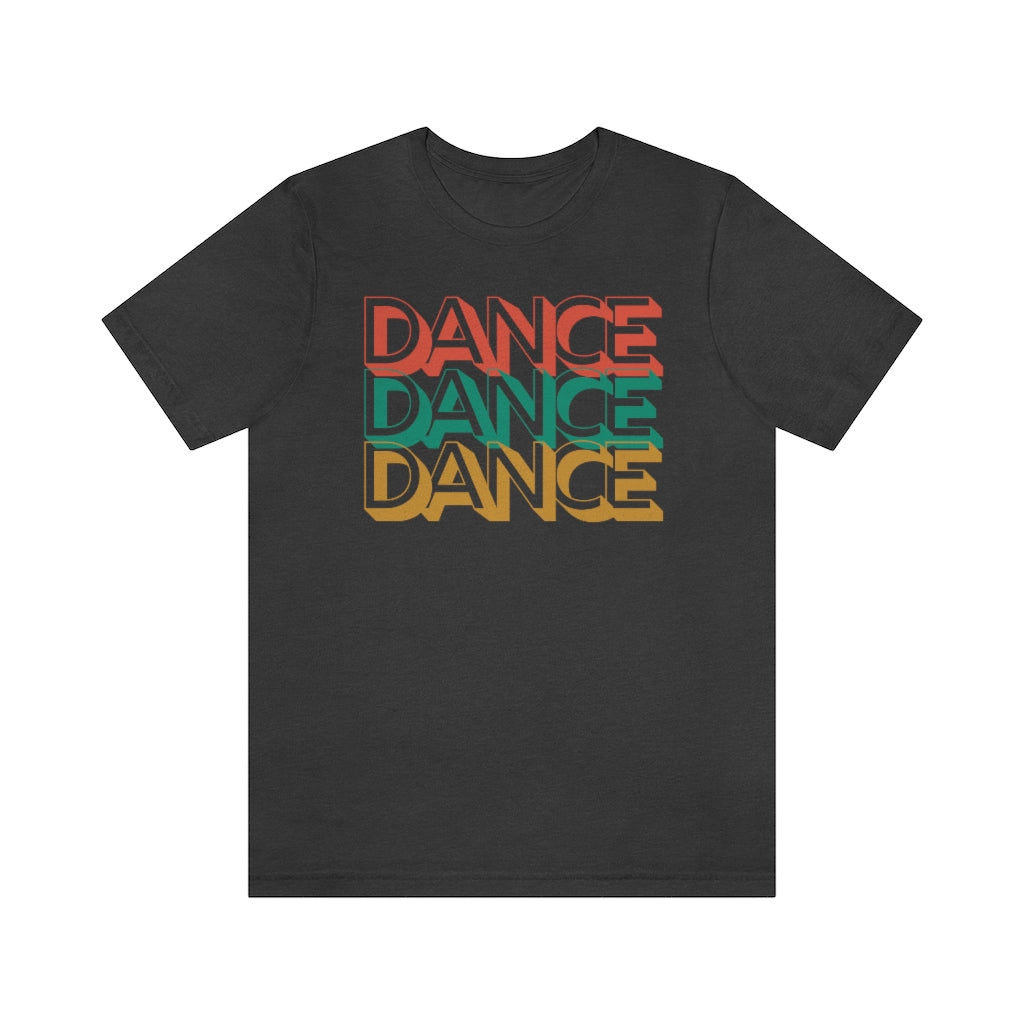 A grey T-shirt with the text "dance dance dance" in a retro color scheme