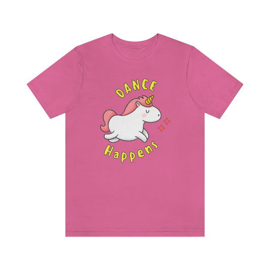 A pink T-shirt with a happy and dancing unicorn with the text "dance happens"