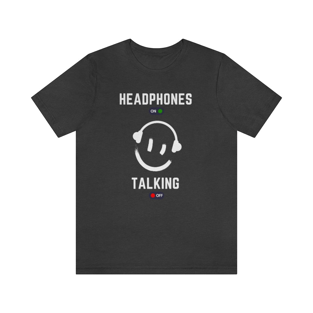 A grey T-shirt with a smiley wearing headphones. it has the text "Headphones on talking off" on it.