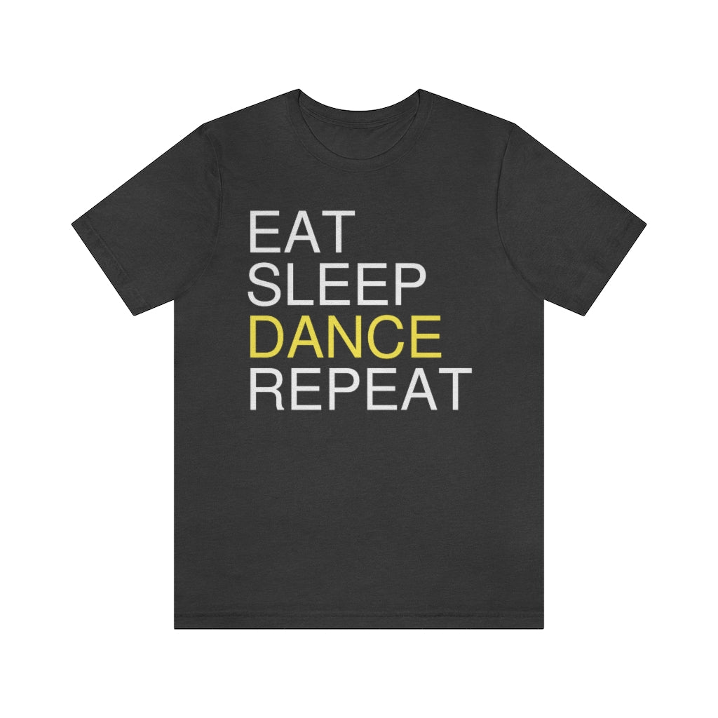 A dark grey T-shirt with the text "eat sleep dance repeat" and the word "dance" is highlighted in yellow.