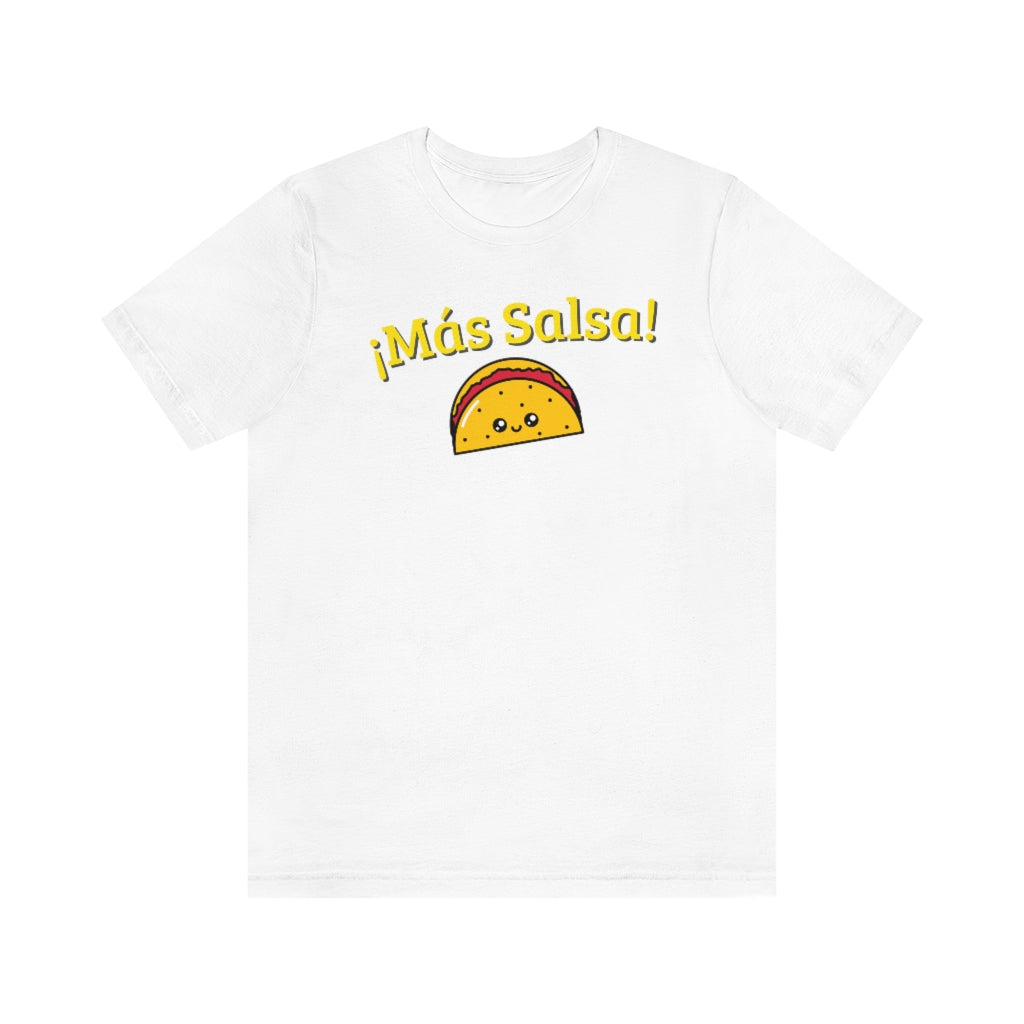 A white T-shirt with the text "Más Salsa!" and with a kawaii taco being happy.