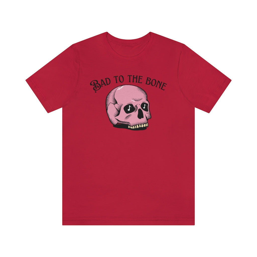 A red T-shirt with the text "bad to the bone" and a cartoony pink skull beneath it  having music notes in its eye sockets.