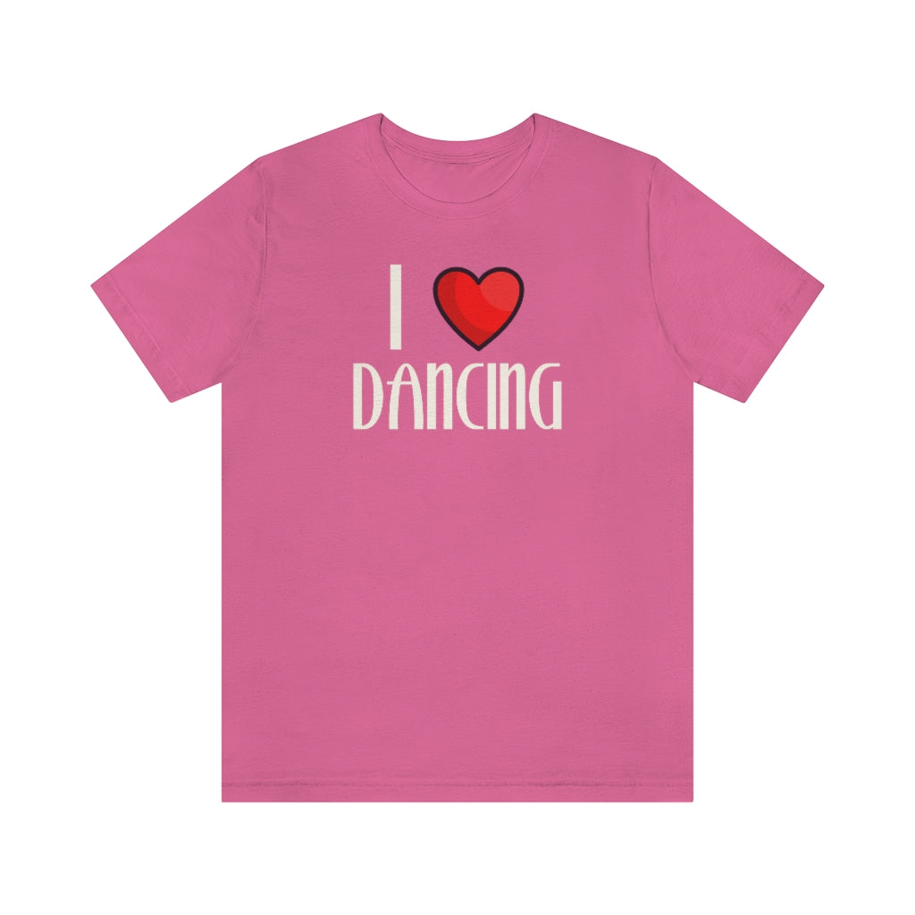 A pink T-shirt with the text "I love dancing" but instead of the word "love" it has a a heart.