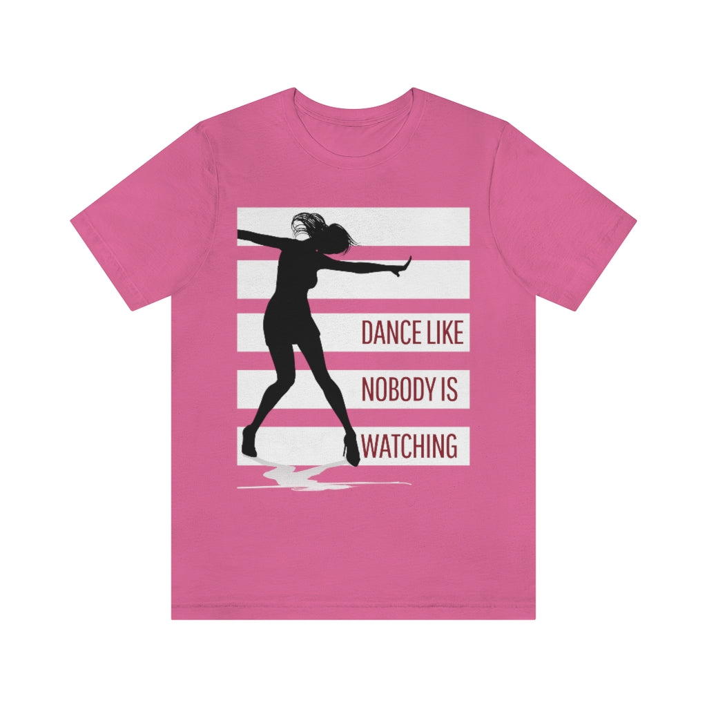 A pink t shirt with white stripes and a dancer in silhouette. It has the text "dance like nobody is watching".