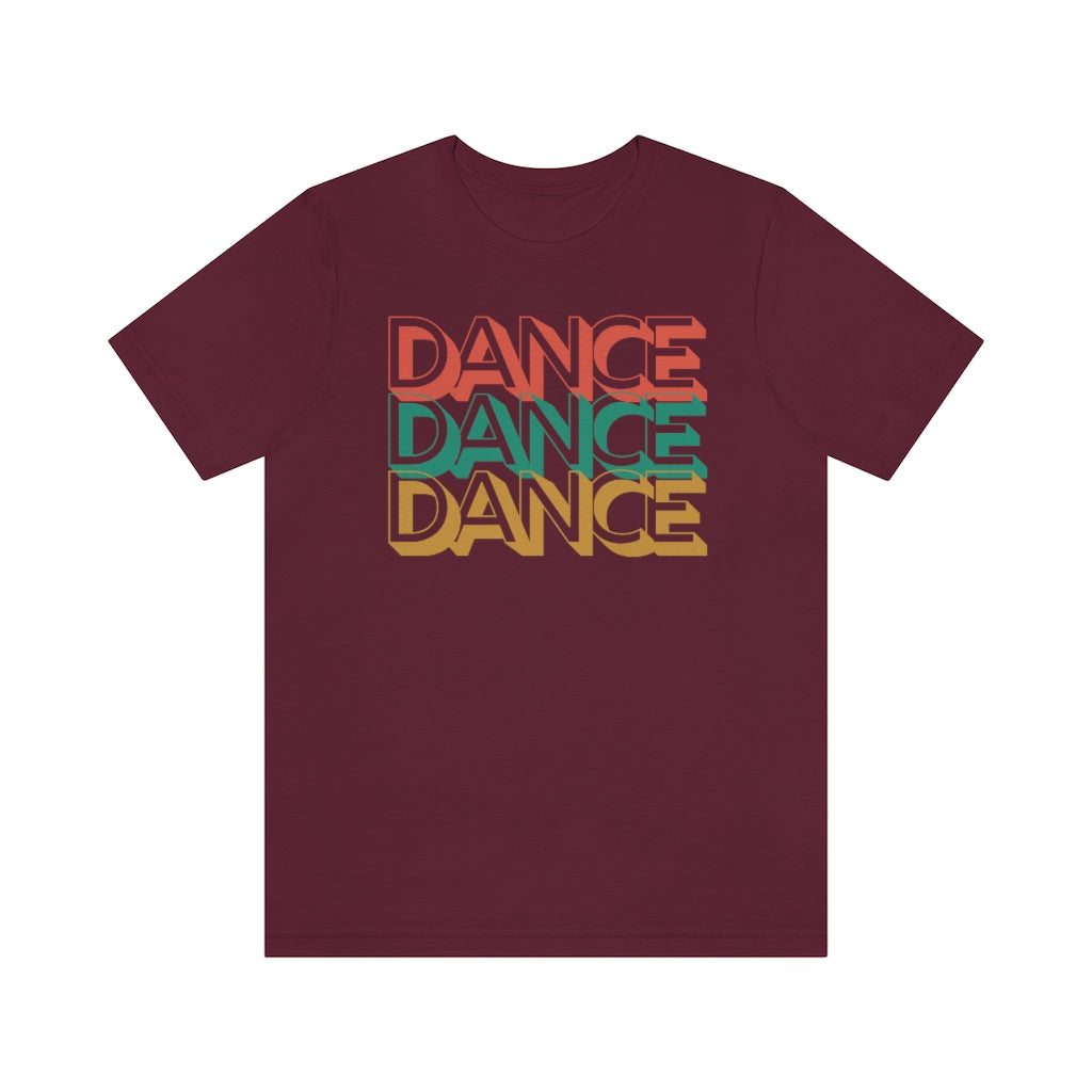 a wine red T-shirt with the text "dance dance dance" in a retro color scheme