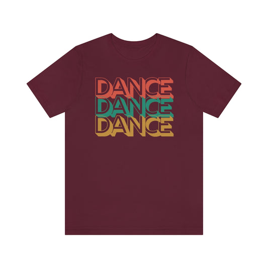 a wine red T-shirt with the text "dance dance dance" in a retro color scheme