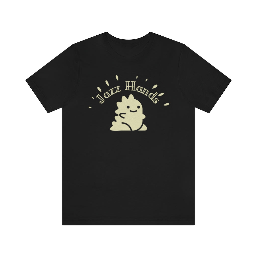 A black T-shirt with an adorable dinosaur. It is waving its proportionally small hands and doing the most charming form of jazz hands. Above it is the text "Jazz Hands" in a very retro font. 